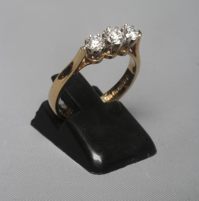 A THREE STONE DIAMOND RING Image