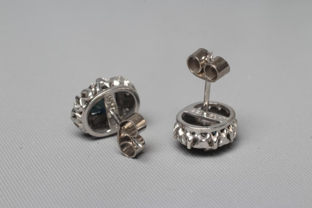 A PAIR OF SAPPHIRE AND DIAMOND OVAL CLUSTER EAR STUDS Image