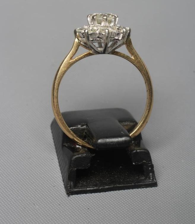 A NINE STONE DIAMOND CLUSTER RING Image