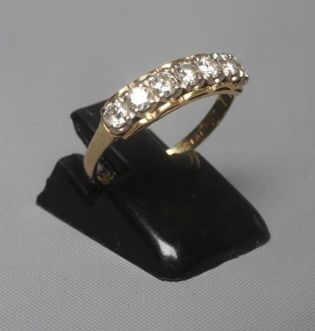 A SEVEN STONE DIAMOND RING Image