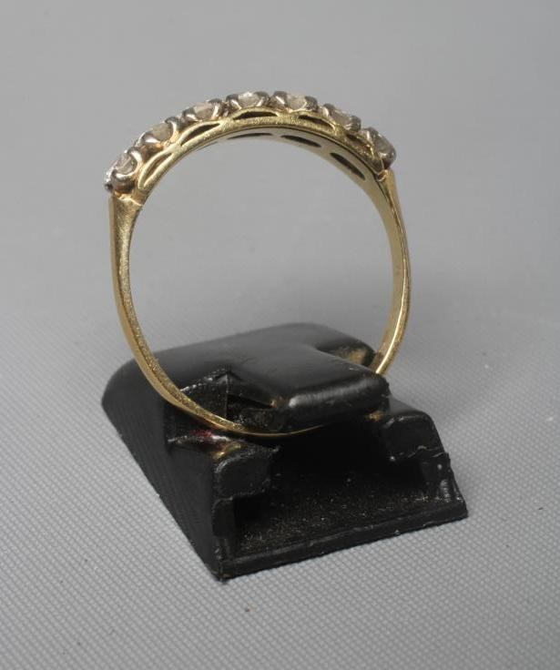 A SEVEN STONE DIAMOND RING Image