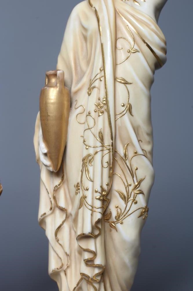 A PAIR OF ROYAL WORCESTER PORCELAIN FIGURES OF WATER CARRIERS Image