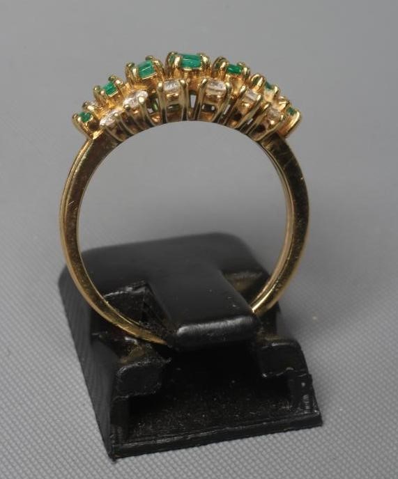 AN EMERALD AND DIAMOND RING Image