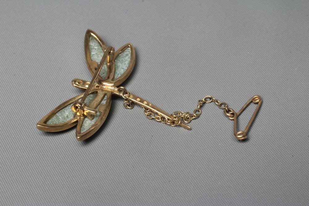 A 9CT GOLD DRAGONFLY BROOCH, the bead cast white body pave set with a small diamond and with celadon Image