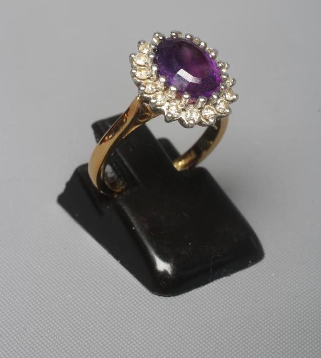 AN AMETHYST AND DIAMOND CLUSTER RING Image