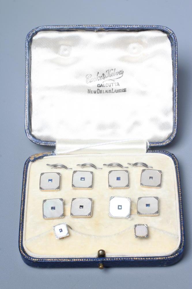 A GENTLEMAN'S DRESS SET with hatch carved mother-of-pearl square panels centred by small square cut Image