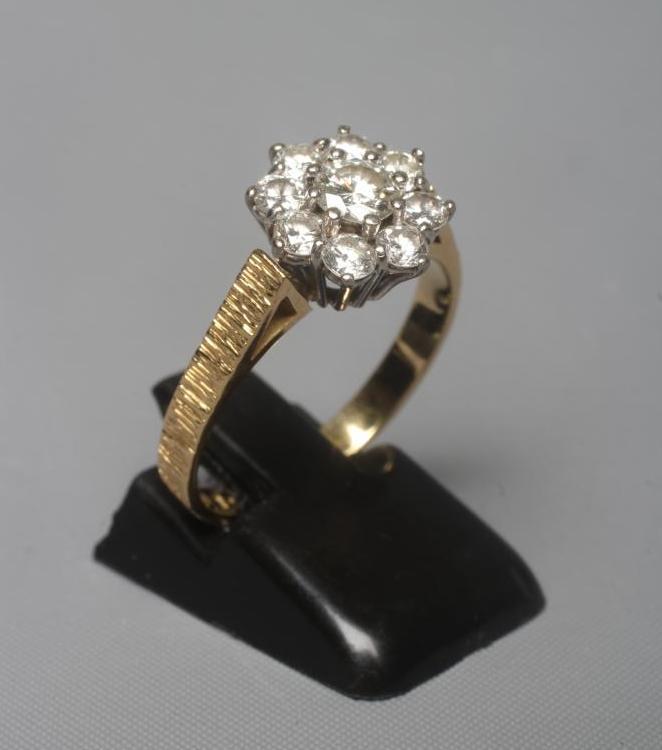 A NINE STONE DIAMOND CLUSTER RING Image