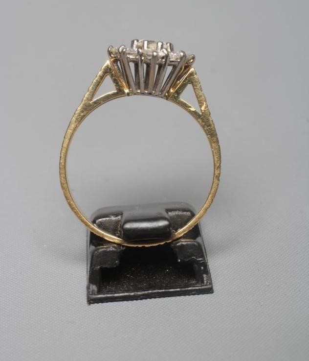 A NINE STONE DIAMOND CLUSTER RING Image