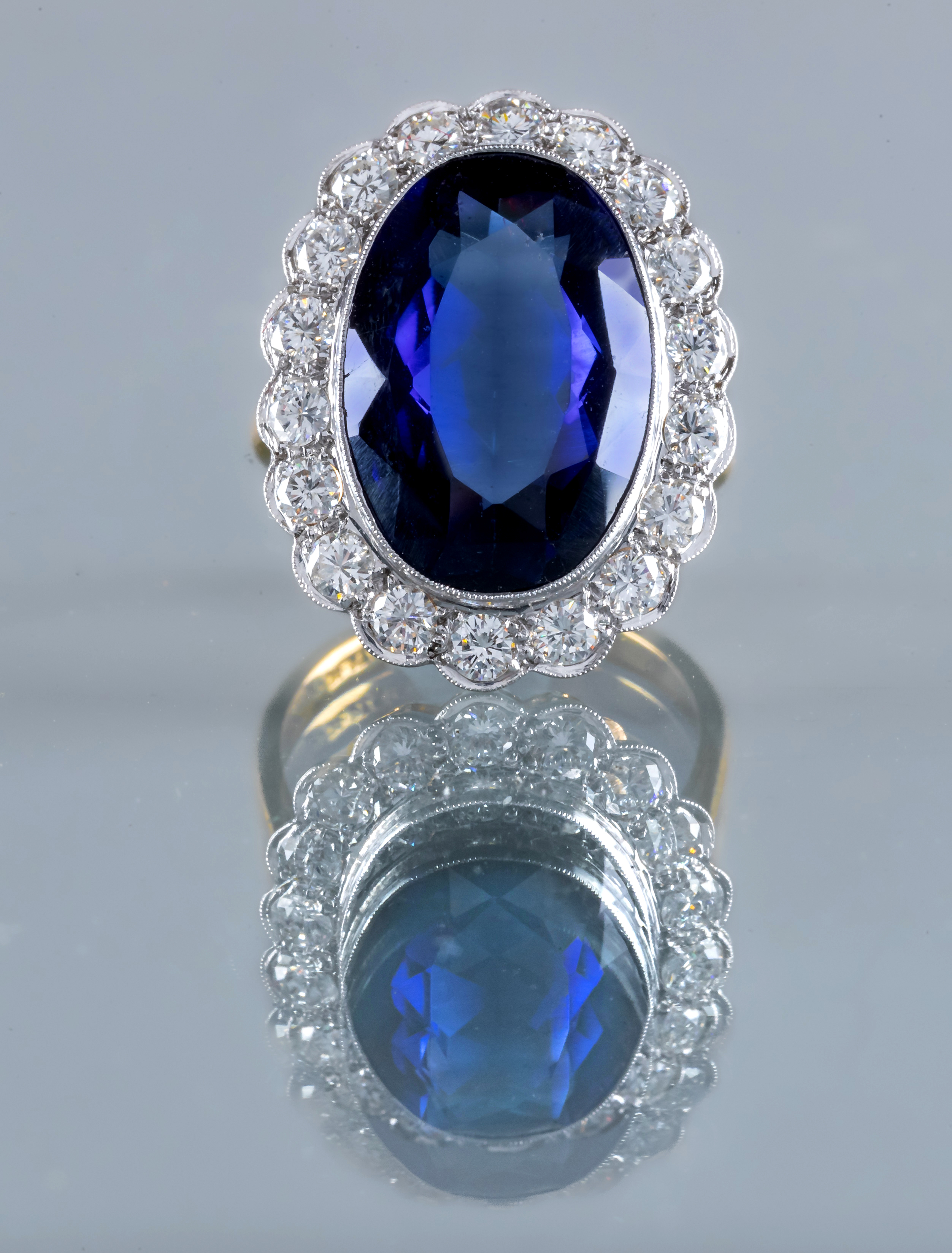 A SAPPHIRE AND DIAMOND CLUSTER RING Image