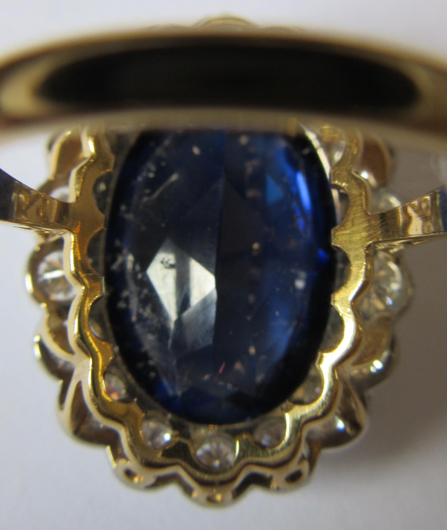 A SAPPHIRE AND DIAMOND CLUSTER RING Image