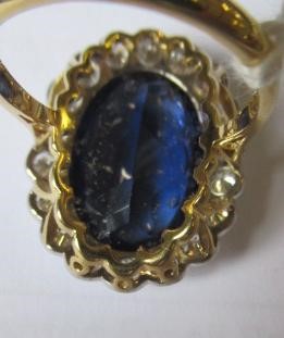A SAPPHIRE AND DIAMOND CLUSTER RING Image