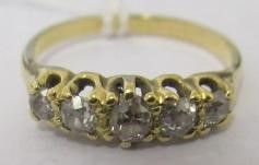 A FIVE STONE DIAMOND RING, the old cut stones claw set to a plain unmarked shank, size Q (Est. plus Image