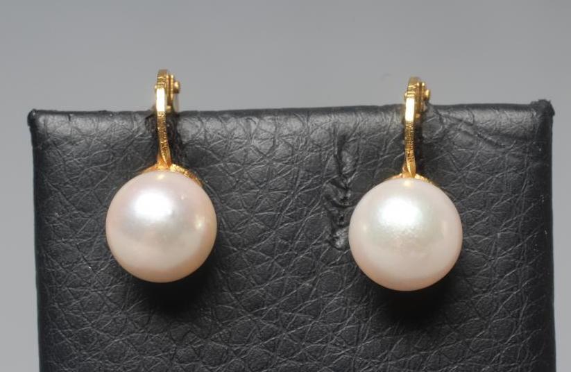 A PAIR OF CULTURED PEARL CLIP EARRINGS the plain mounts stamped 9 carat gold (Est. plus 24% premium Image