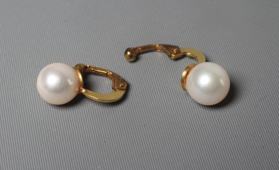 A PAIR OF CULTURED PEARL CLIP EARRINGS the plain mounts stamped 9 carat gold (Est. plus 24% premium Image