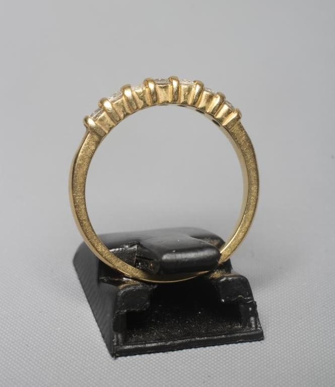 A SEVEN STONE DIAMOND RING, the brilliant cut stones each of approximately 0.40cts, line set to a Image