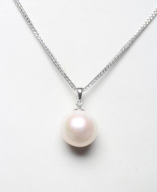 A CULTURED PEARL DROP PENDANT with platinum mount, on a platinum chain necklace with spring ring Image