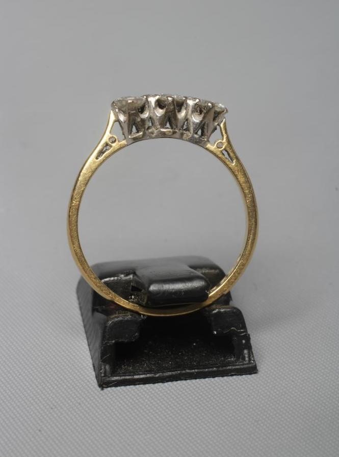 A THREE STONE DIAMOND RING, the brilliant cut stones each of approximately 0.25cts, claw set to a Image