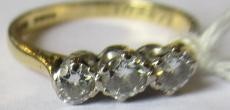 A THREE STONE DIAMOND RING, the brilliant cut stones each of approximately 0.25cts, claw set to a Image