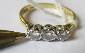 A THREE STONE DIAMOND RING, the brilliant cut stones each of approximately 0.25cts, claw set to a Image