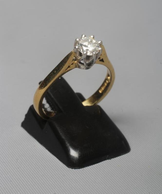 A DIAMOND SOLITAIRE RING, the brilliant cut stone of approximately 0.50cts claw set to a plain 18ct Image