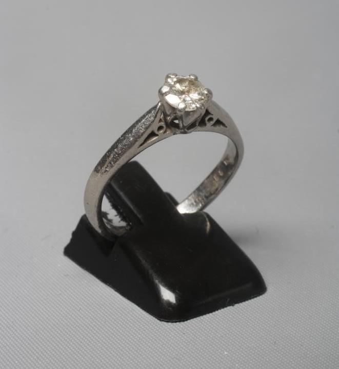 A SOLITAIRE DIAMOND RING, the round brilliant cut stone of 0.58cts, claw set to a plain platinum Image