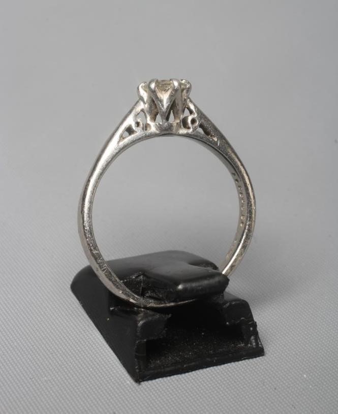 A SOLITAIRE DIAMOND RING, the round brilliant cut stone of 0.58cts, claw set to a plain platinum Image