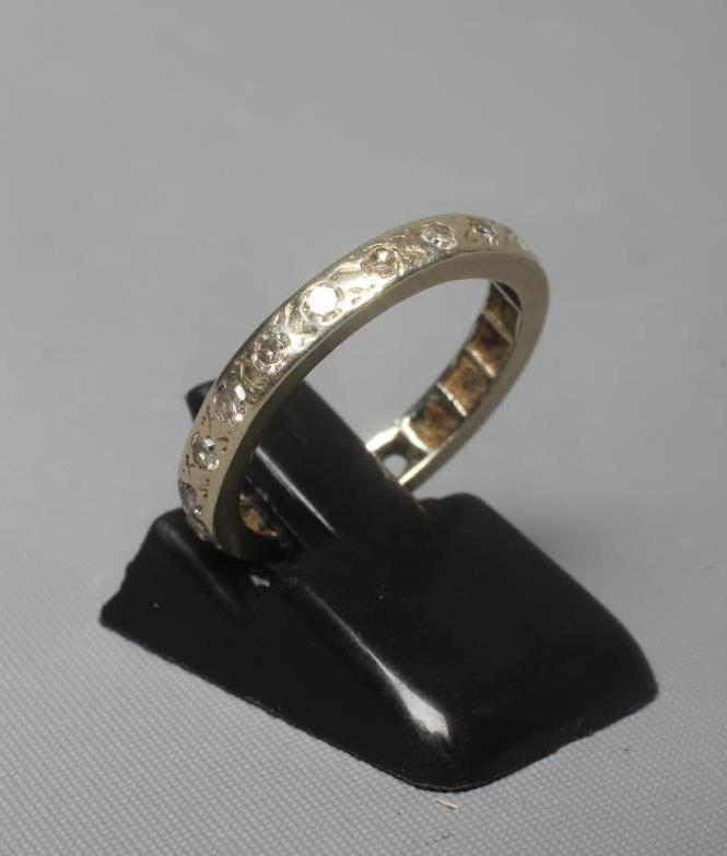 A DIAMOND ETERNITY RING, unmarked, size L (Est. plus 24% premium inc. VAT) Image