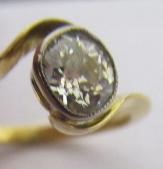 A SOLITAIRE DIAMOND RING, the old cut stone of approximately 0.5cts in a cross over setting to a Image