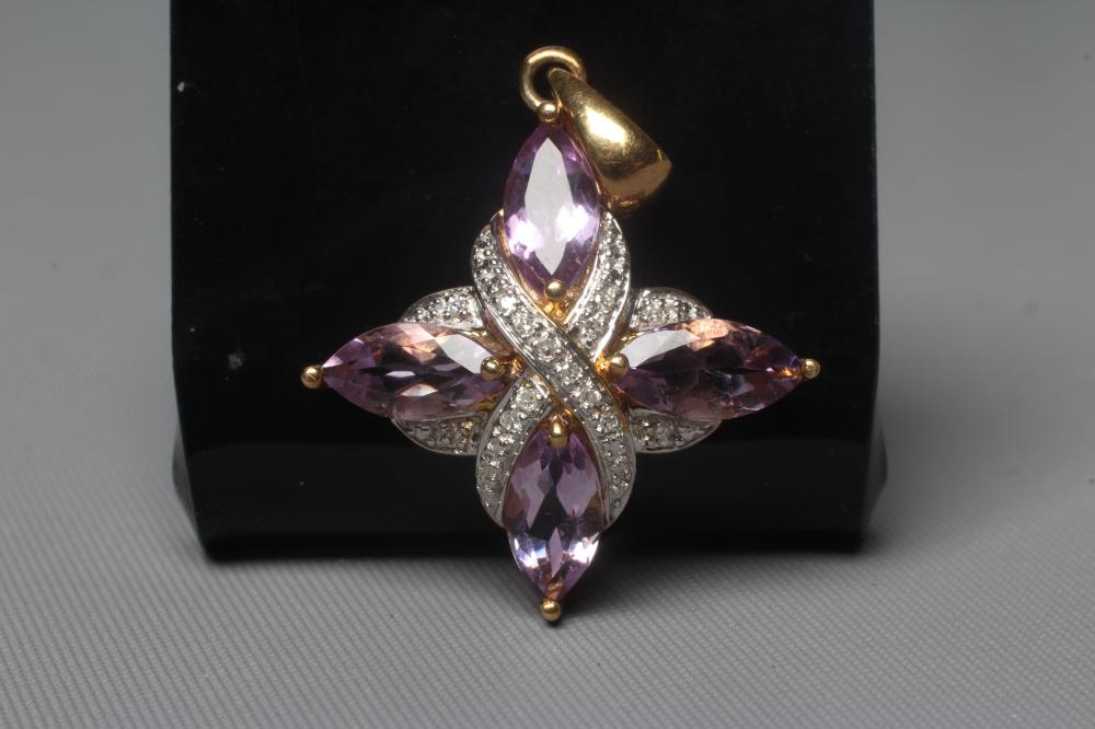 AN AMETHYST AND DIAMOND PENDANT, the four marquise cut amethysts claw set with pave diamond set Image