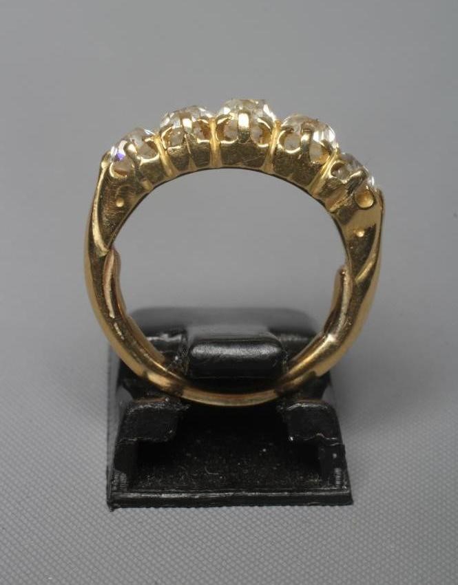A FIVE STONE DIAMOND HALF HOOP RING, the old cut stones each of approximately 0.25cts, all claw set Image