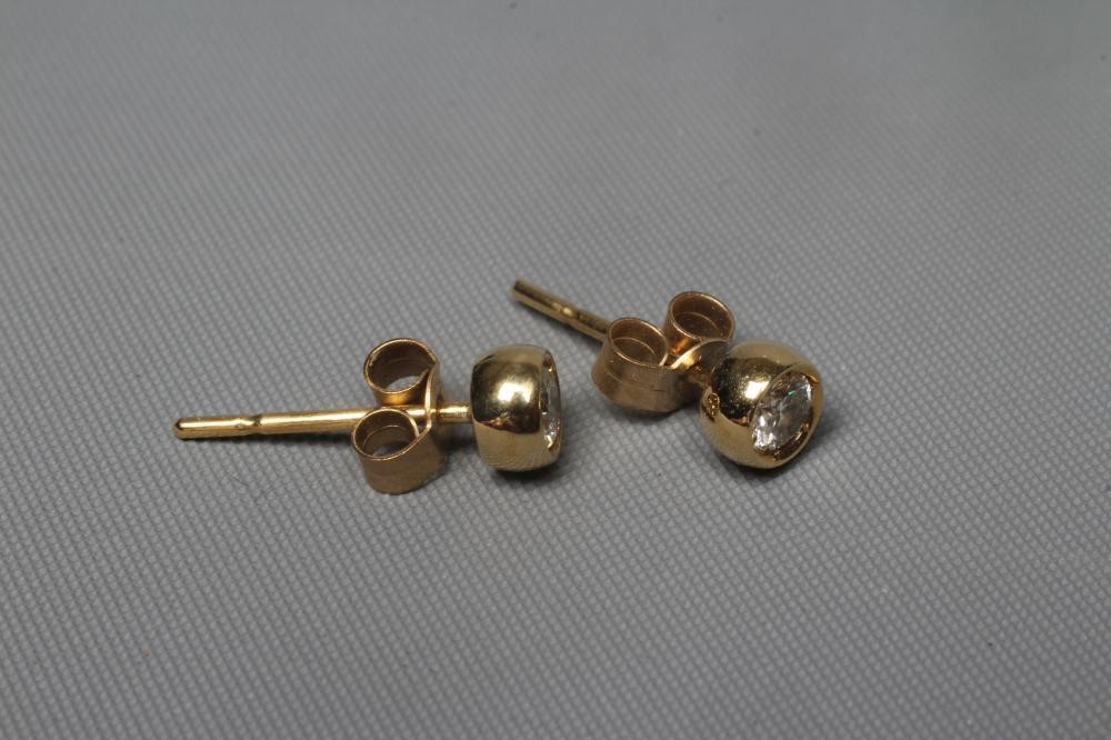 A PAIR OF DIAMOND SOLITAIRE EAR STUDS, the brilliant cut stones each of approximately 0.06cts, to Image