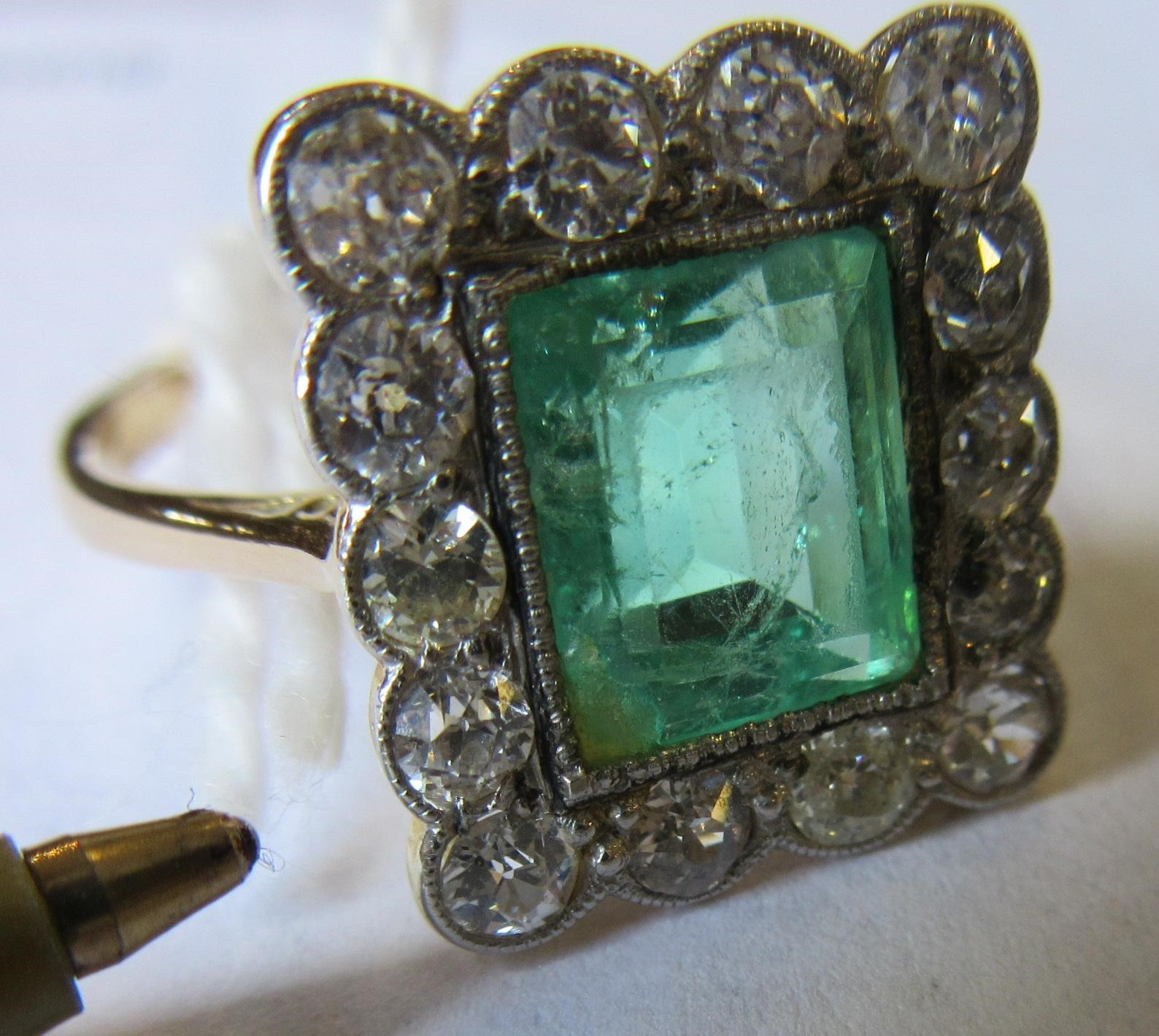 AN EMERALD AND DIAMOND PLAQUE RING Image