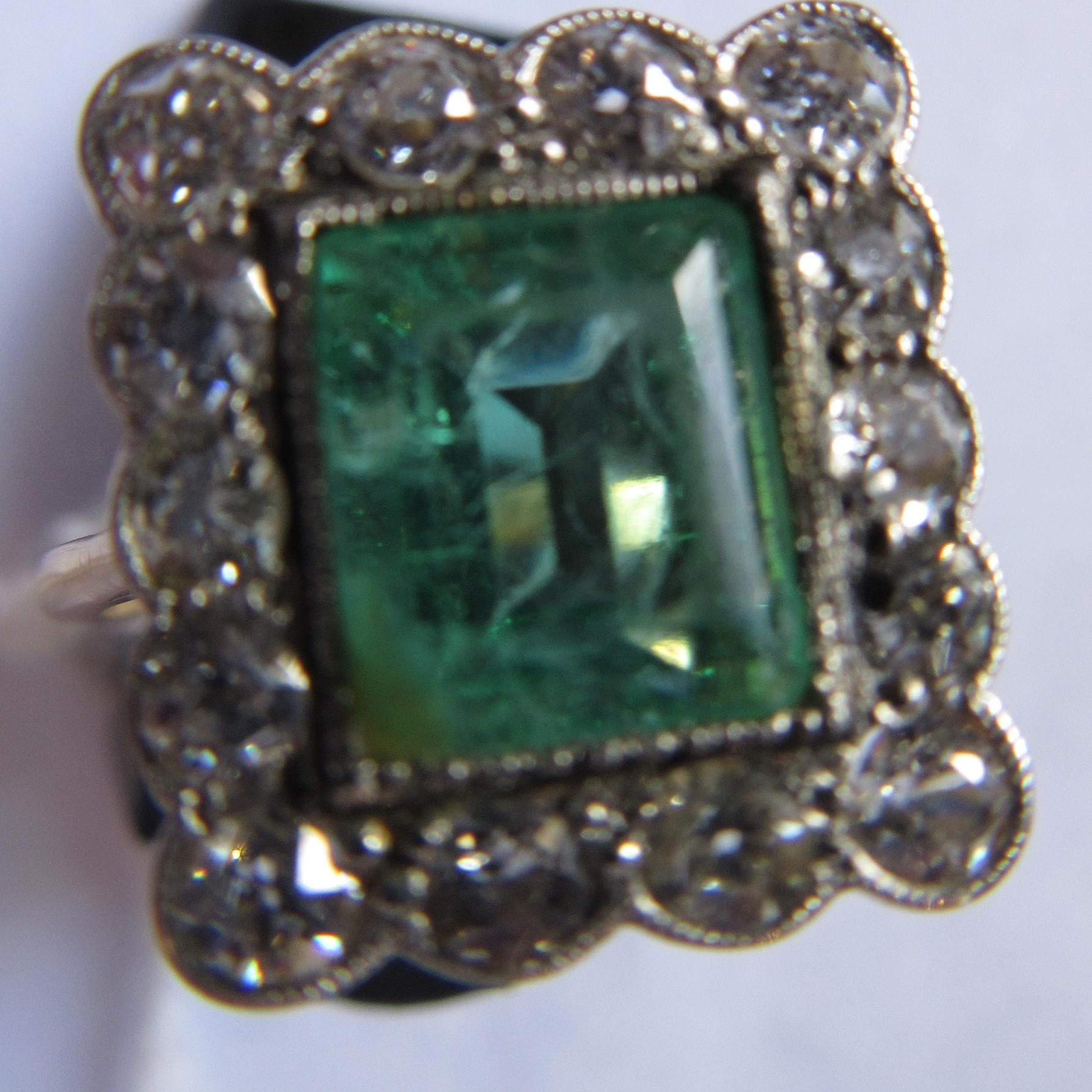 AN EMERALD AND DIAMOND PLAQUE RING Image