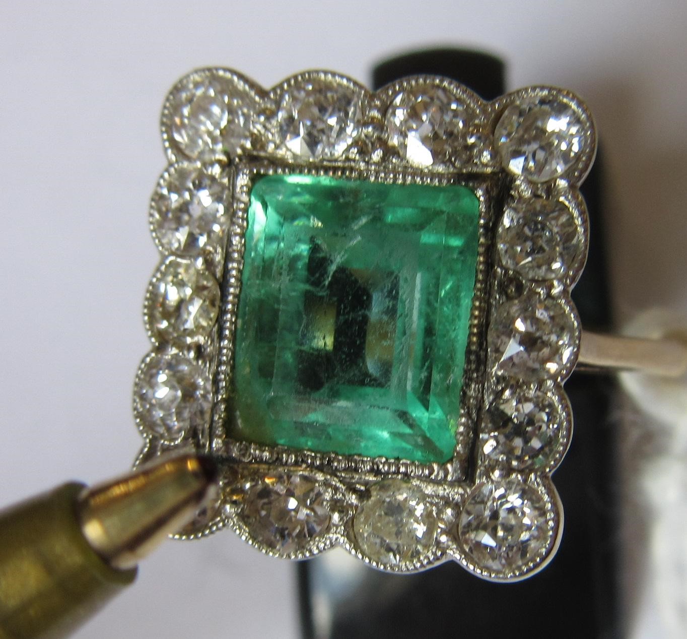 AN EMERALD AND DIAMOND PLAQUE RING Image