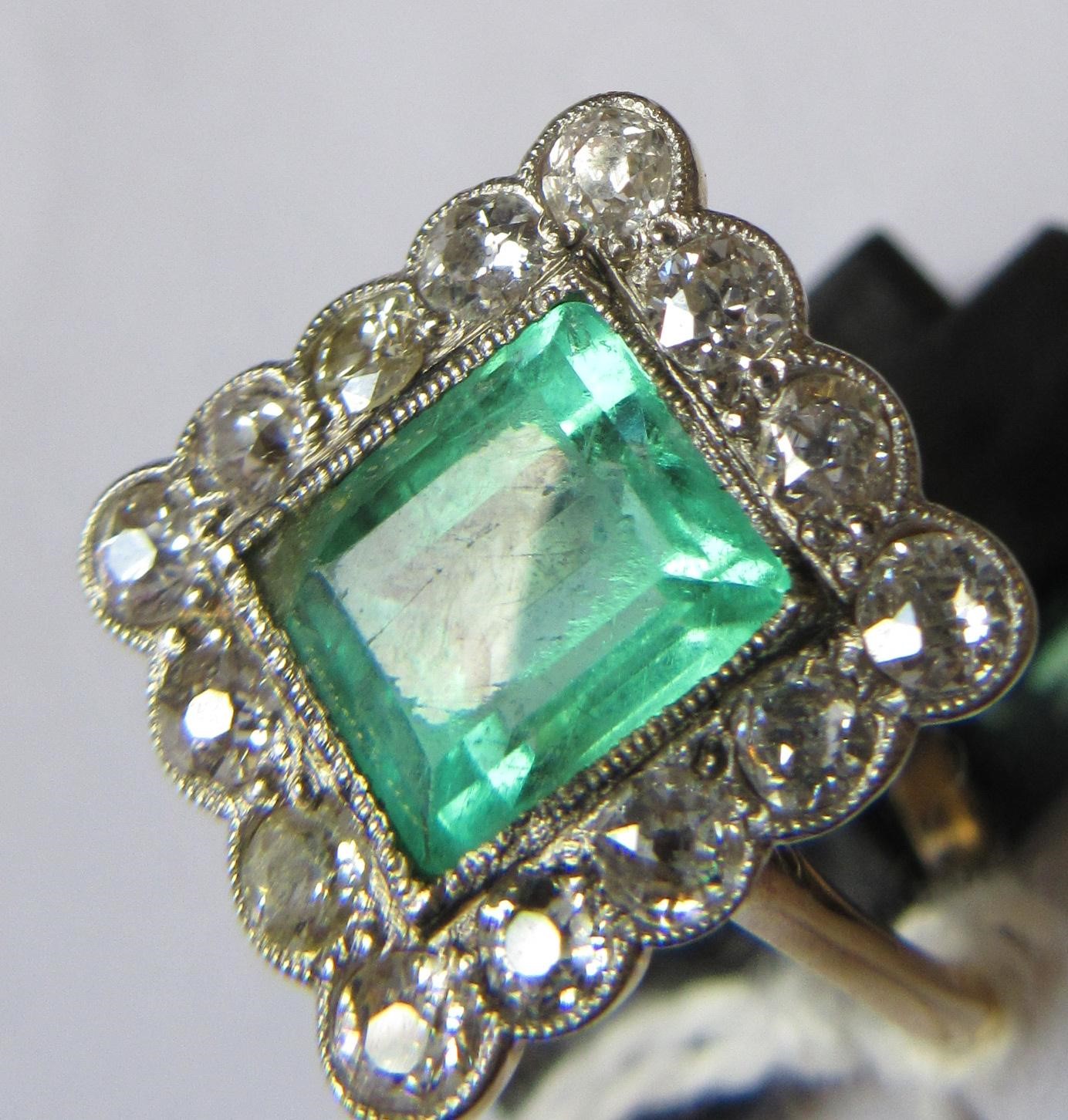 AN EMERALD AND DIAMOND PLAQUE RING Image
