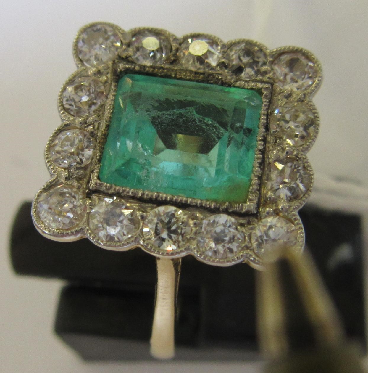 AN EMERALD AND DIAMOND PLAQUE RING Image