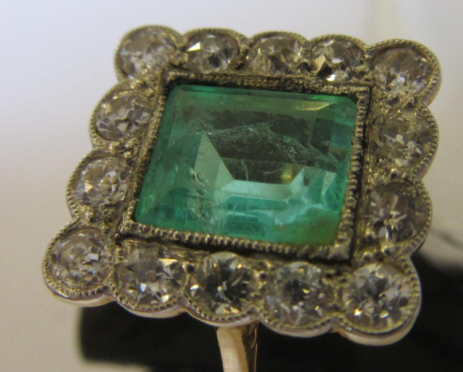 AN EMERALD AND DIAMOND PLAQUE RING Image
