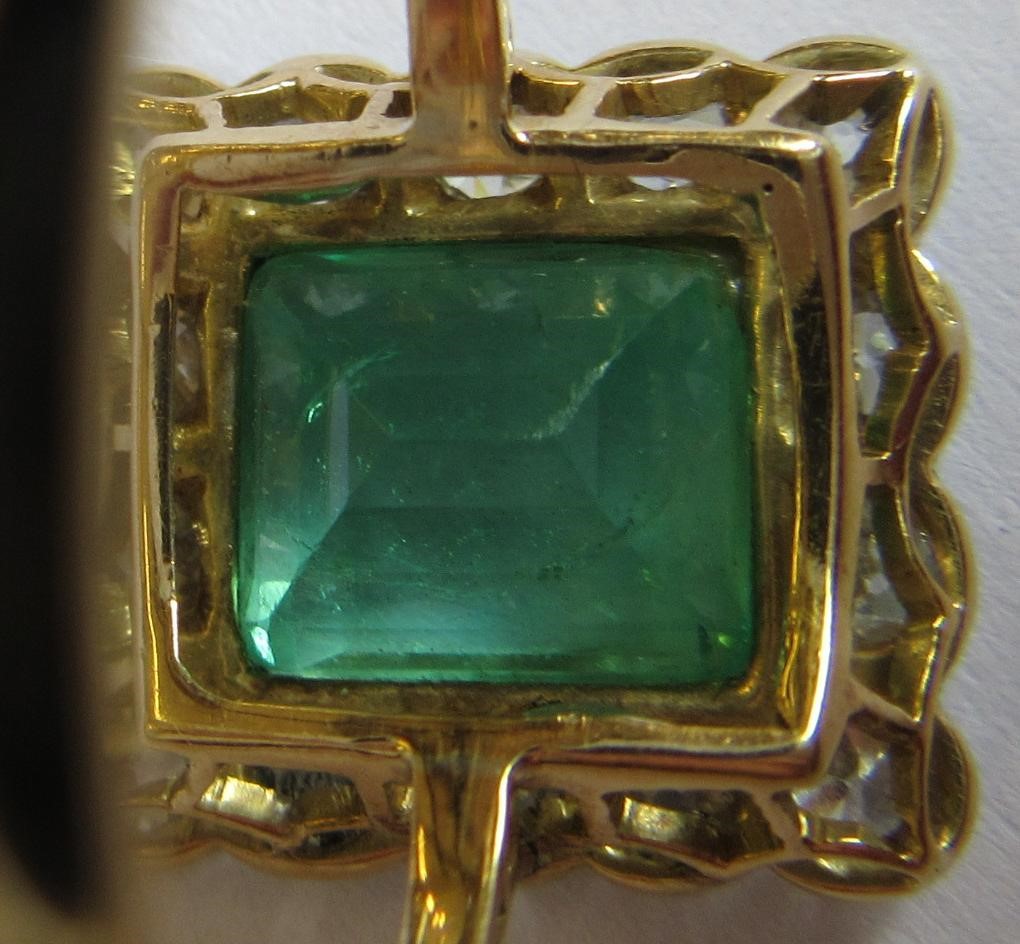 AN EMERALD AND DIAMOND PLAQUE RING Image