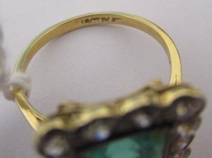 AN EMERALD AND DIAMOND PLAQUE RING Image