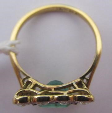 AN EMERALD AND DIAMOND PLAQUE RING Image