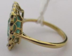 AN EMERALD AND DIAMOND PLAQUE RING Image