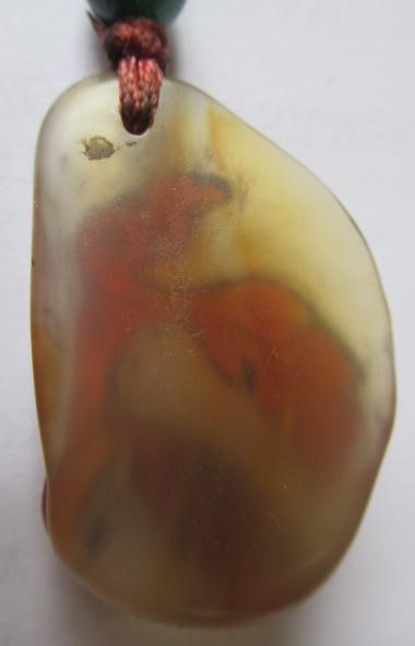 TWO CHINESE CARVED HARDSTONE PENDANTS on silk cords with aventurine bead 'ojime' (Est. plus 24% Image