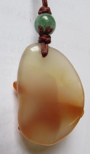 TWO CHINESE CARVED HARDSTONE PENDANTS on silk cords with aventurine bead 'ojime' (Est. plus 24% Image