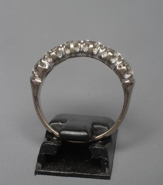 A SIX STONE DIAMOND RING, the round brilliant cut stones each of approximately 0.40cts (TCW approx. Image