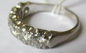 A SIX STONE DIAMOND RING, the round brilliant cut stones each of approximately 0.40cts (TCW approx. Image