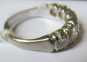 A SIX STONE DIAMOND RING, the round brilliant cut stones each of approximately 0.40cts (TCW approx. Image