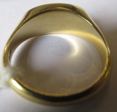 A BLACK OPAL RING, the eliptical polished stone in a rub-over setting to a plain 18ct gold shank, Image