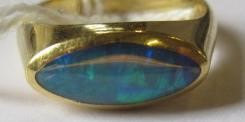 A BLACK OPAL RING, the eliptical polished stone in a rub-over setting to a plain 18ct gold shank, Image