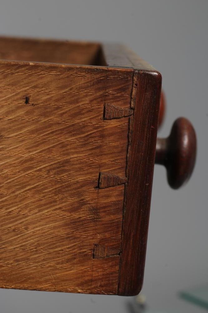 A MINIATURE OAK CHEST OF DRAWERS Image