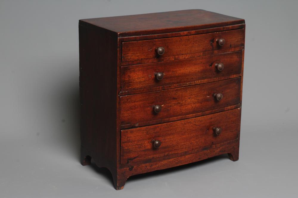 A MAHOGANY BOW FRONT CHEST OF DRAWERS Image